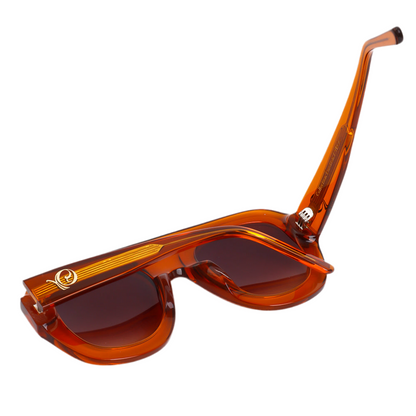 Photo des Lunettes de soleil orange translucide aux teintes ambrées profondes  de la marque VROC. 